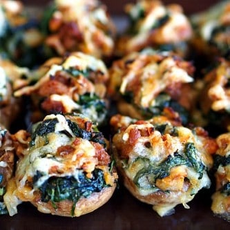 A picture of spinach stuffed mushrooms