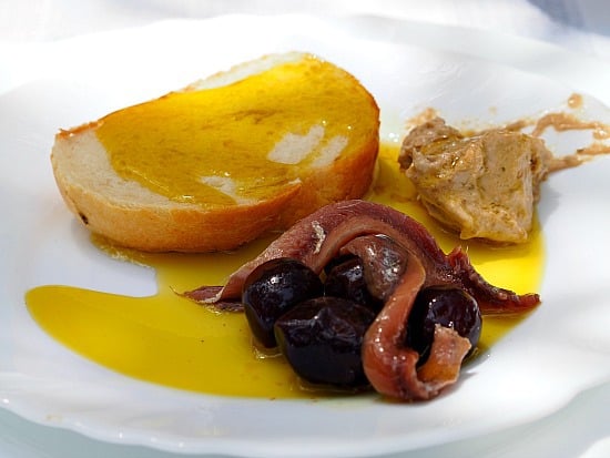 A little somthin, somthin before lunch. Fresh anchovies, olives, fish pate, bread and oh yeah, olive oil! OMG!