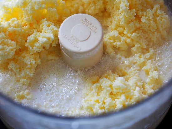 After 5-6 minutes in the food processor, the butter will separate from the buttermilk. It looks like this and is ready to be transferred to the cheese cloth.