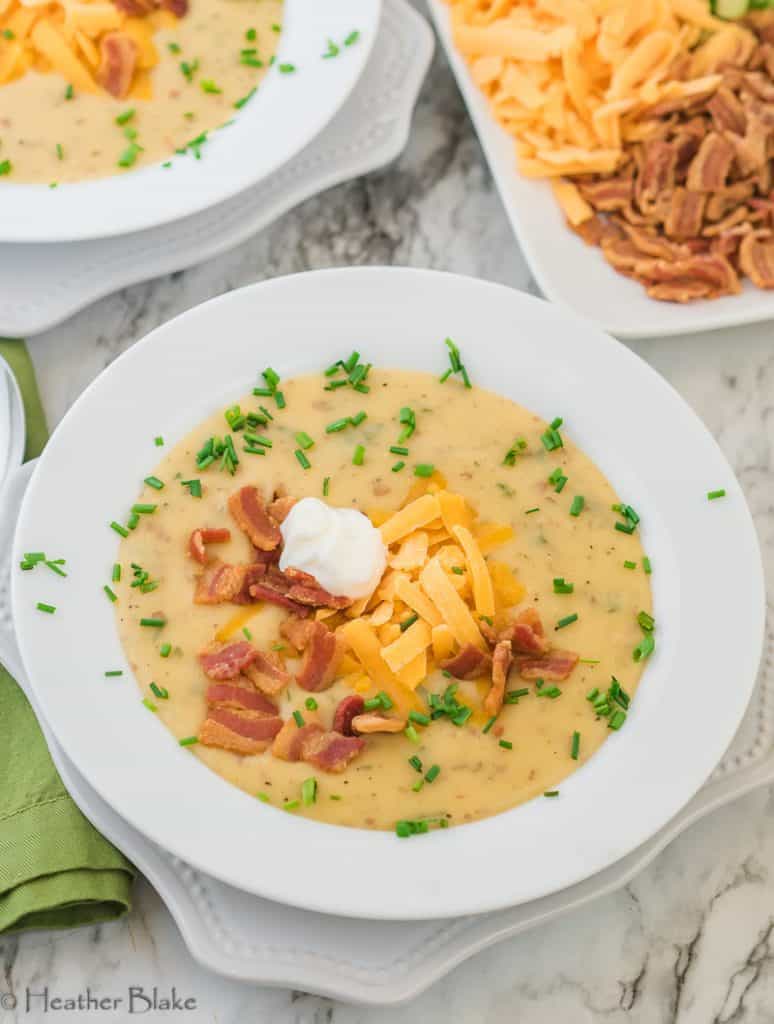 A picture of Roasted Potato Garlic soup with cheese and bacon