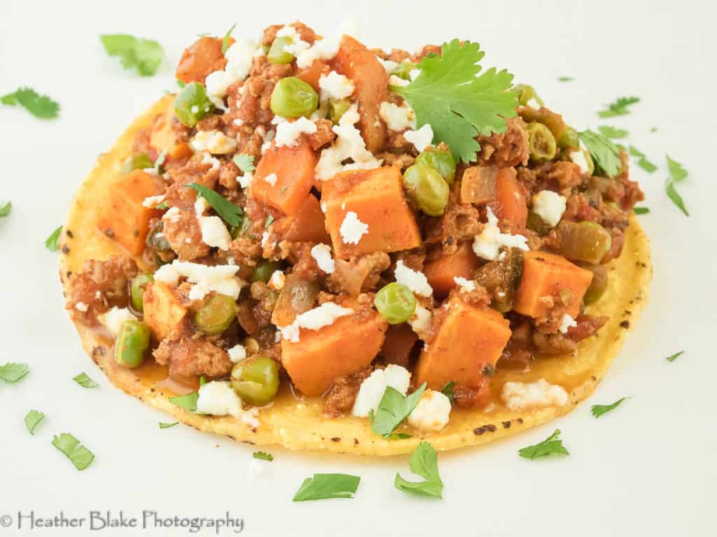 A picture of Mexican Picadillo on top of a Tostada.
