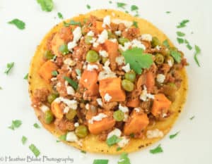 A picture of Mexican Picadillo on top of a tostada.