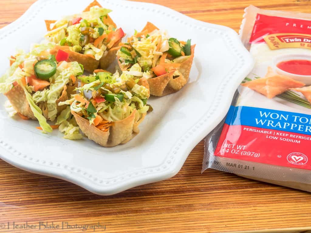A picture of the Bahn Mi Won Ton cups with a package of the Twin Dragon won ton wrappers.